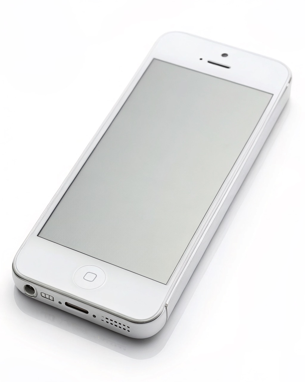 White slim smartphone with a matte grayscale e-ink screen showing only black text, single small rear camera, plain rounded body, no logos or branding visible